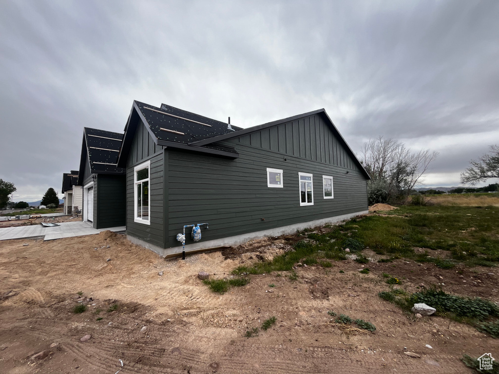 View of side of property featuring a garage