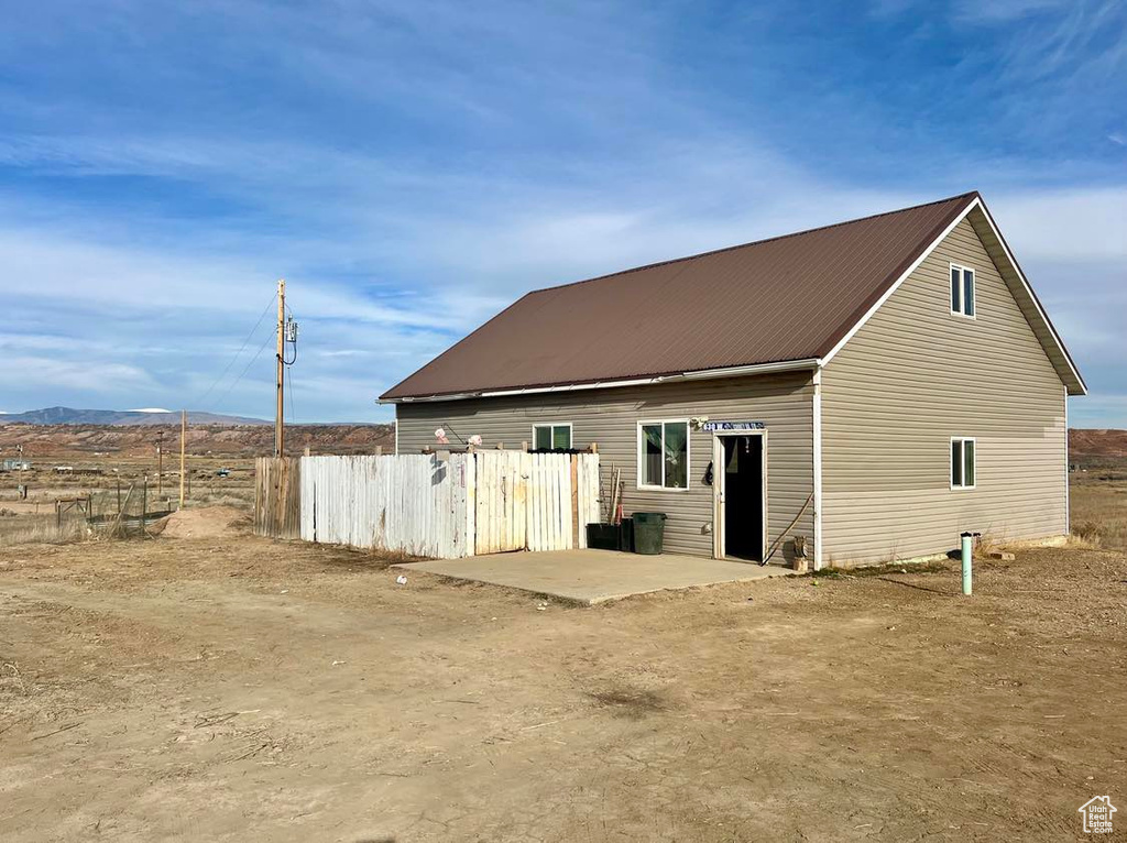 Back of house with a mountain view