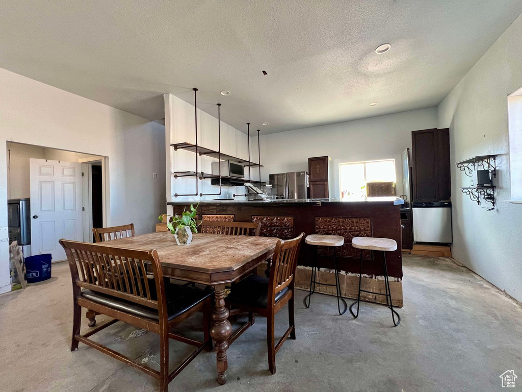 Dining area with a textured ceiling