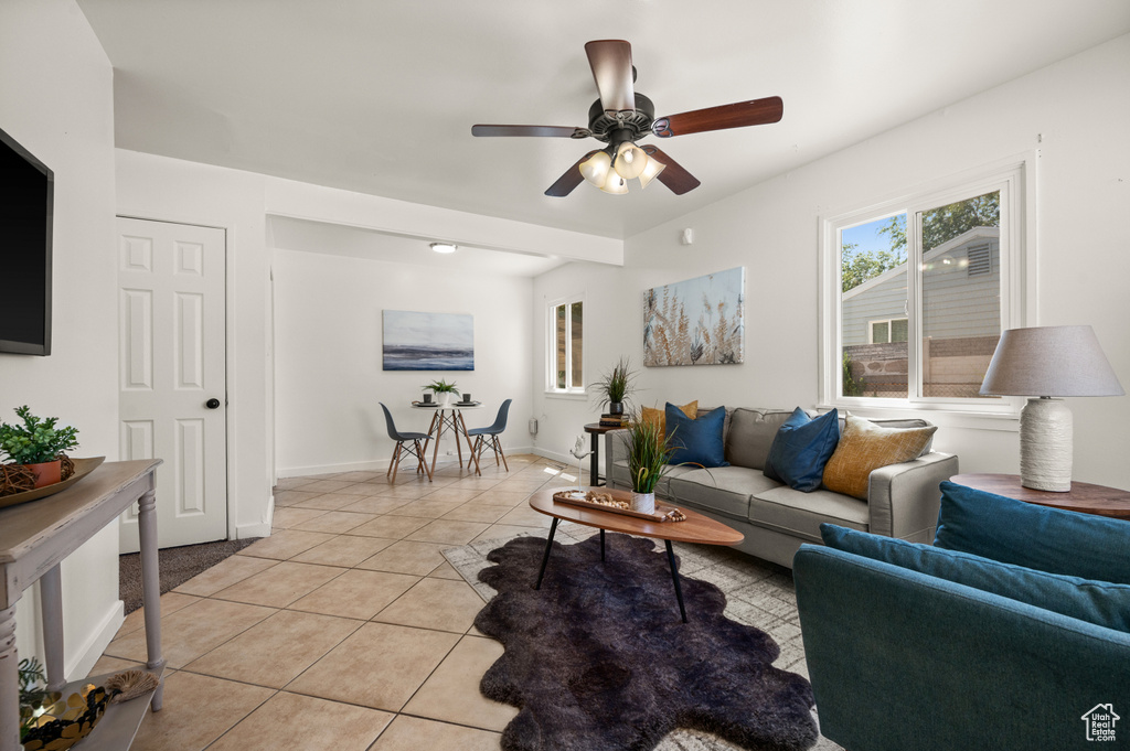 Tiled living room featuring ceiling fan