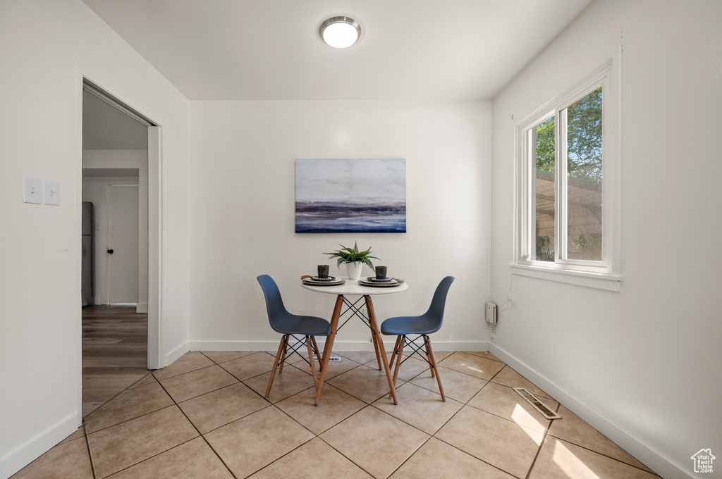 Dining room featuring light tile patterned flooring