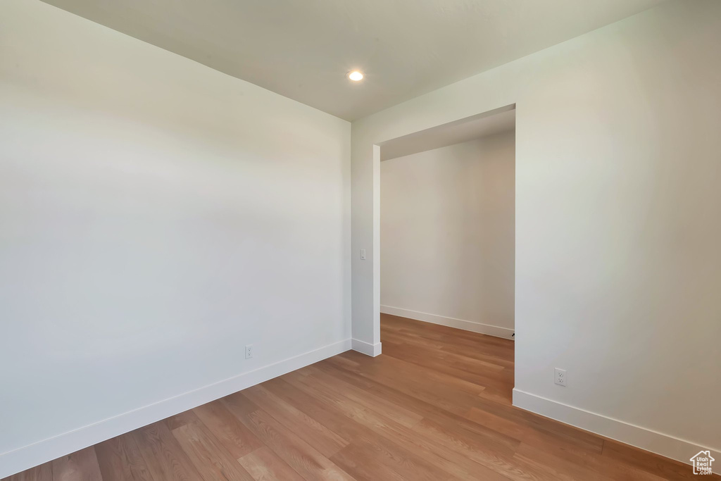 Unfurnished room with hardwood / wood-style flooring