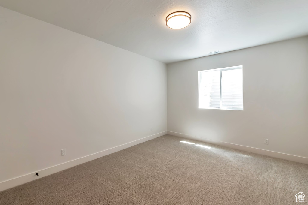 View of carpeted spare room