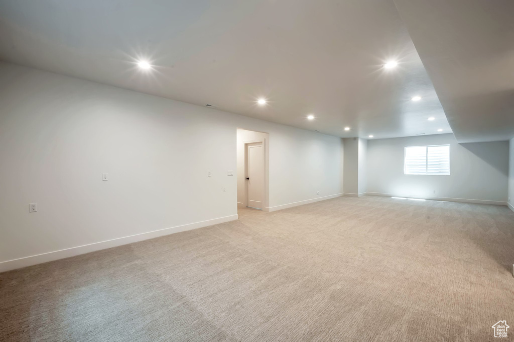 Basement with light carpet