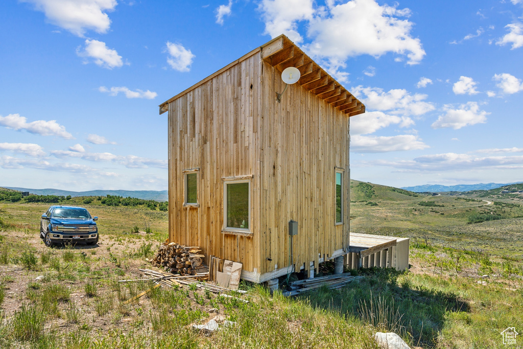 View of outbuilding with a rural view