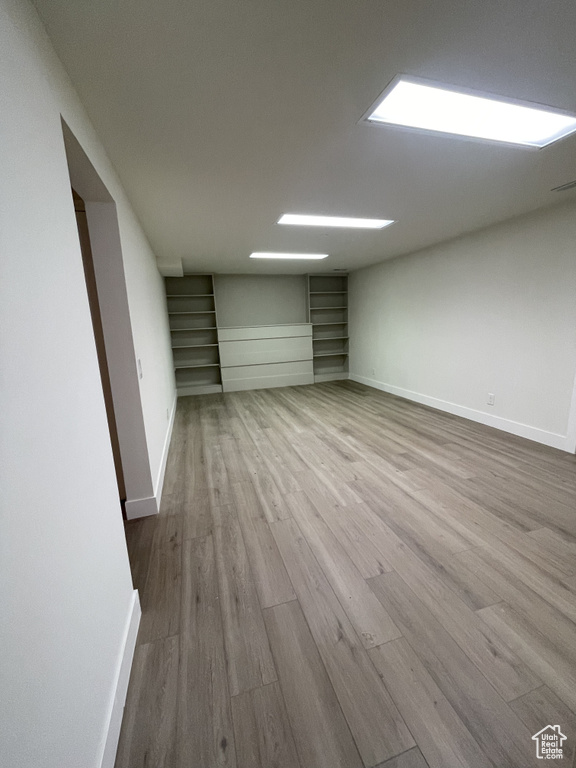 Basement featuring hardwood / wood-style floors