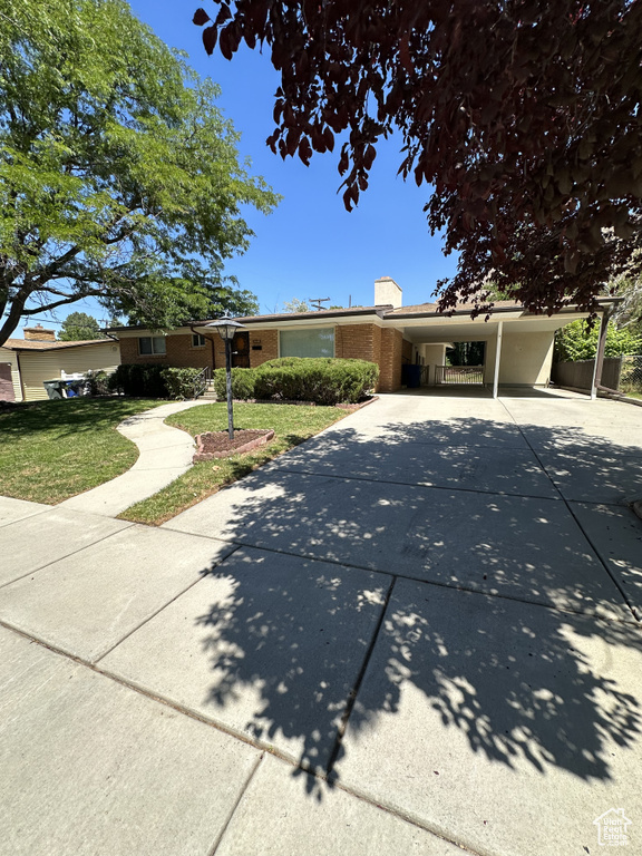 View of front of property with a carport