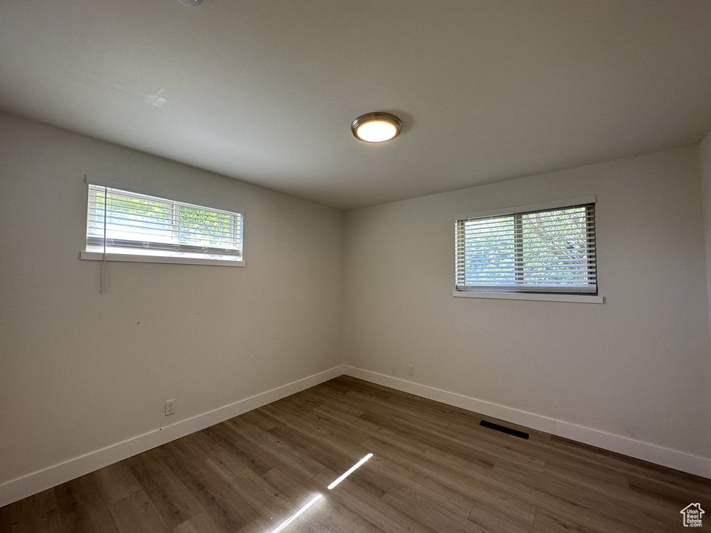 Empty room featuring wood-type flooring