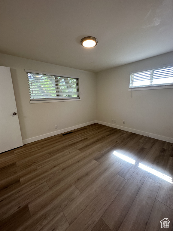 Empty room featuring hardwood / wood-style floors