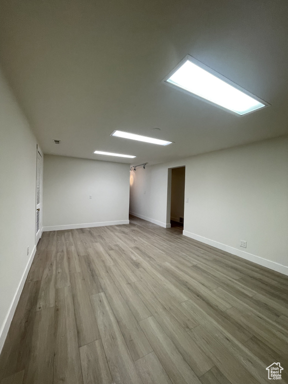 Basement with hardwood / wood-style floors