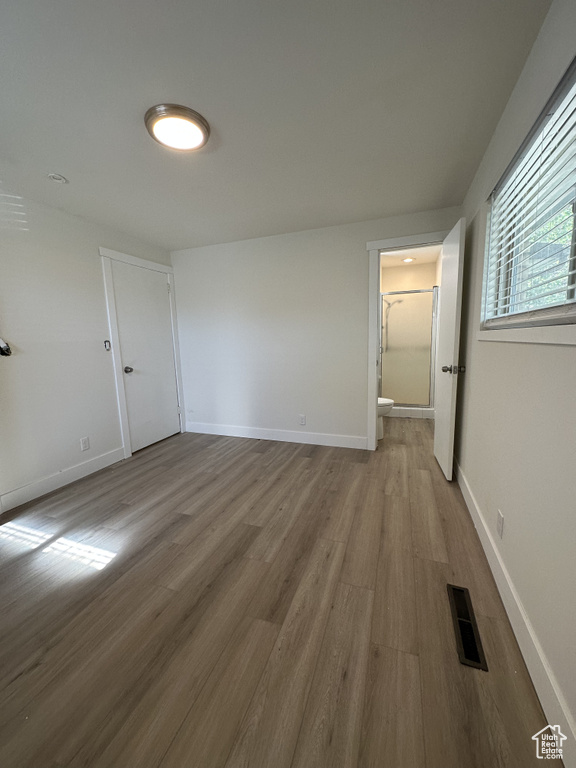 Empty room featuring hardwood / wood-style floors