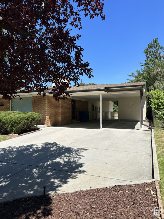 View of front of house featuring a carport