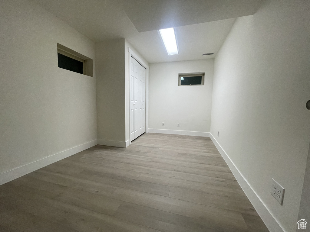 Unfurnished room with hardwood / wood-style floors