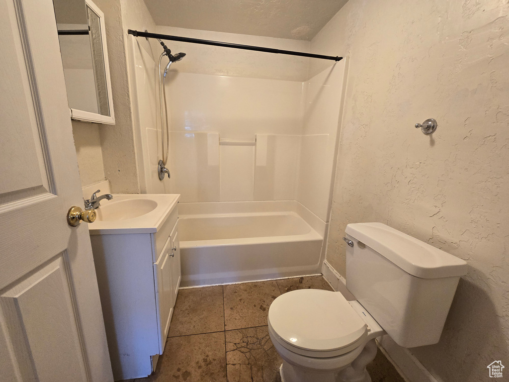 Full bathroom featuring vanity, tile patterned floors, shower / bathing tub combination, and toilet