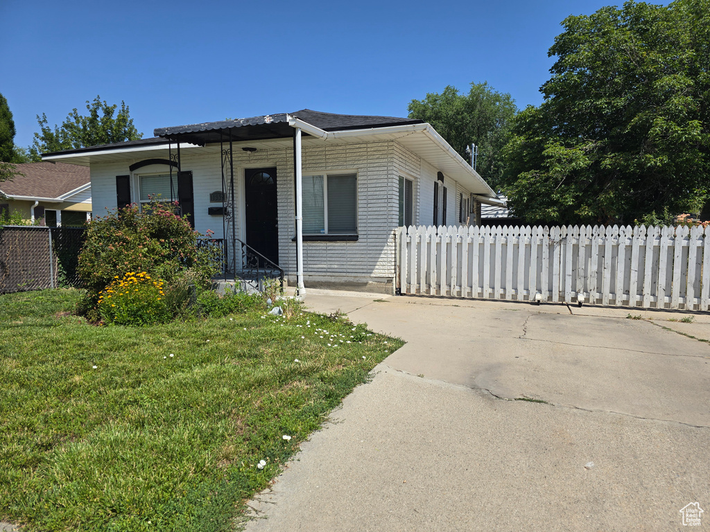 View of front of property with a front yard