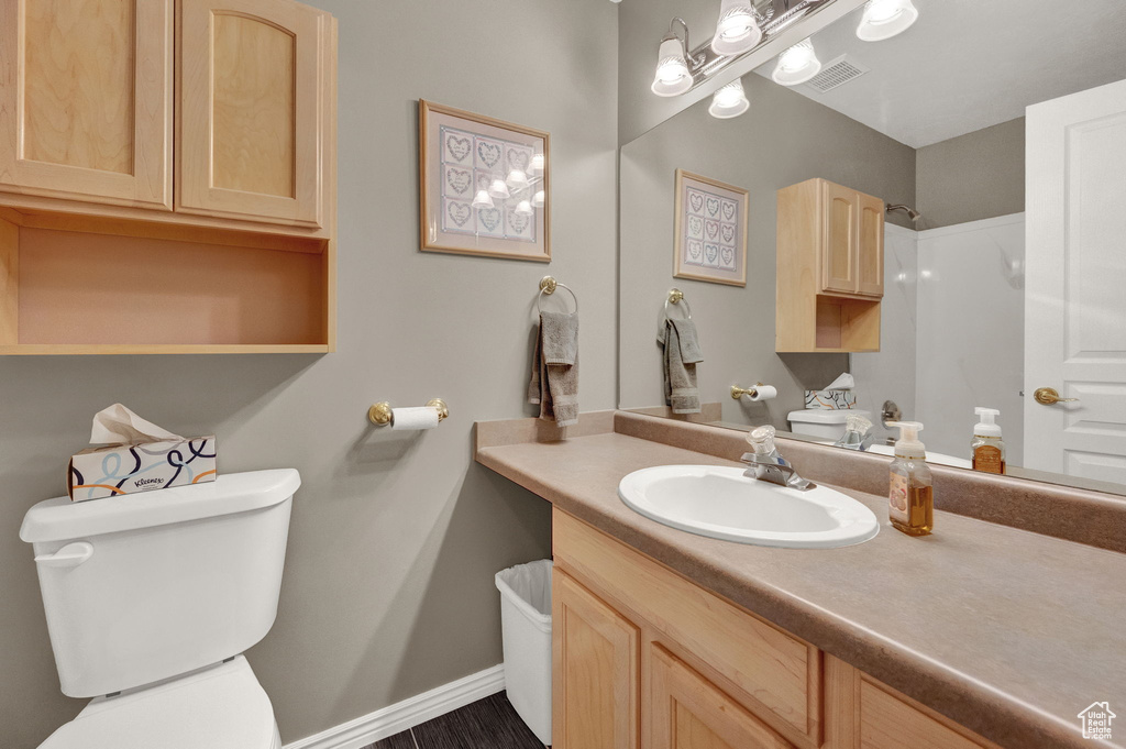 Bathroom with toilet and vanity