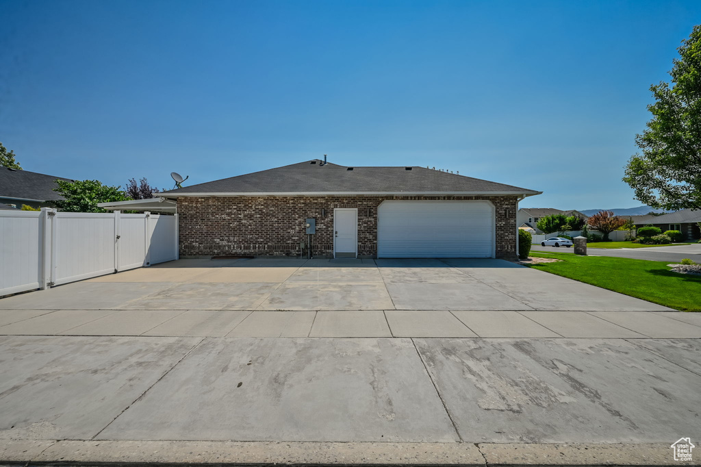 View of property exterior featuring a garage