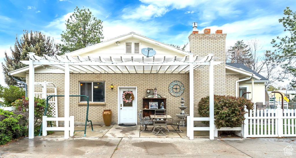 View of front of house featuring a patio and a pergola