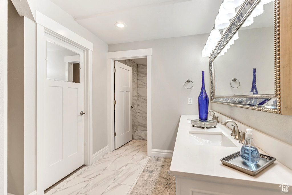 Bathroom featuring vanity and tile patterned flooring