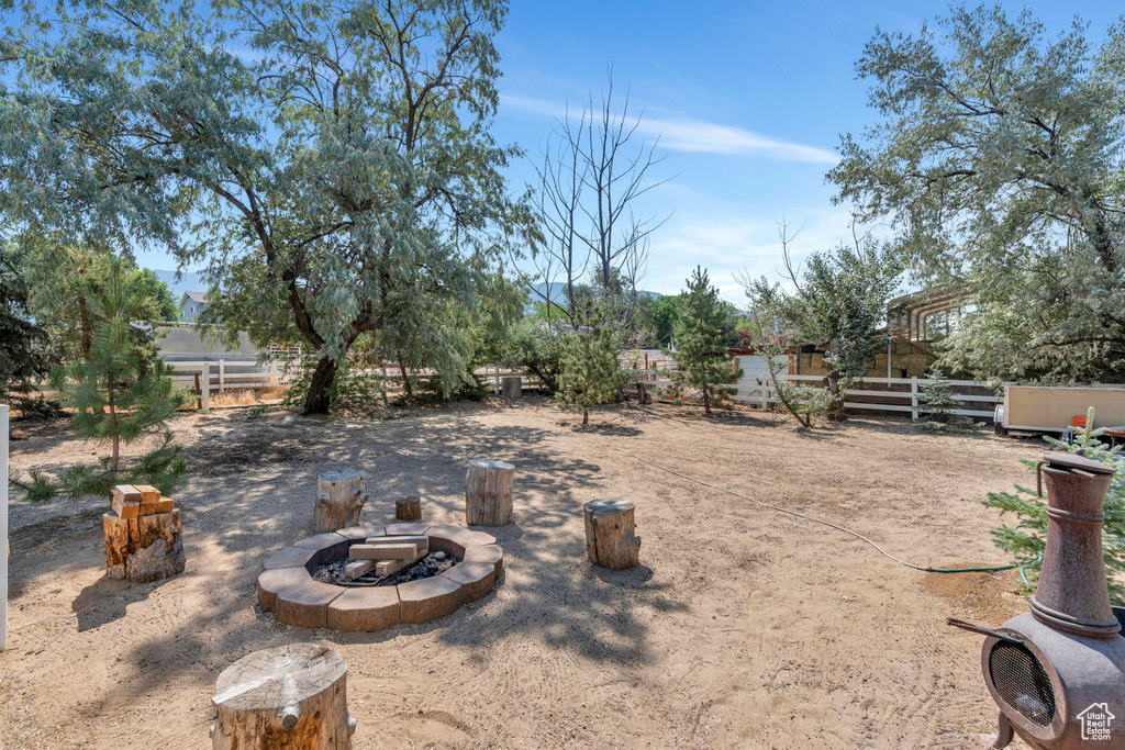 View of yard with a fire pit