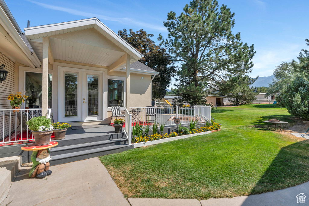 View of yard featuring french doors