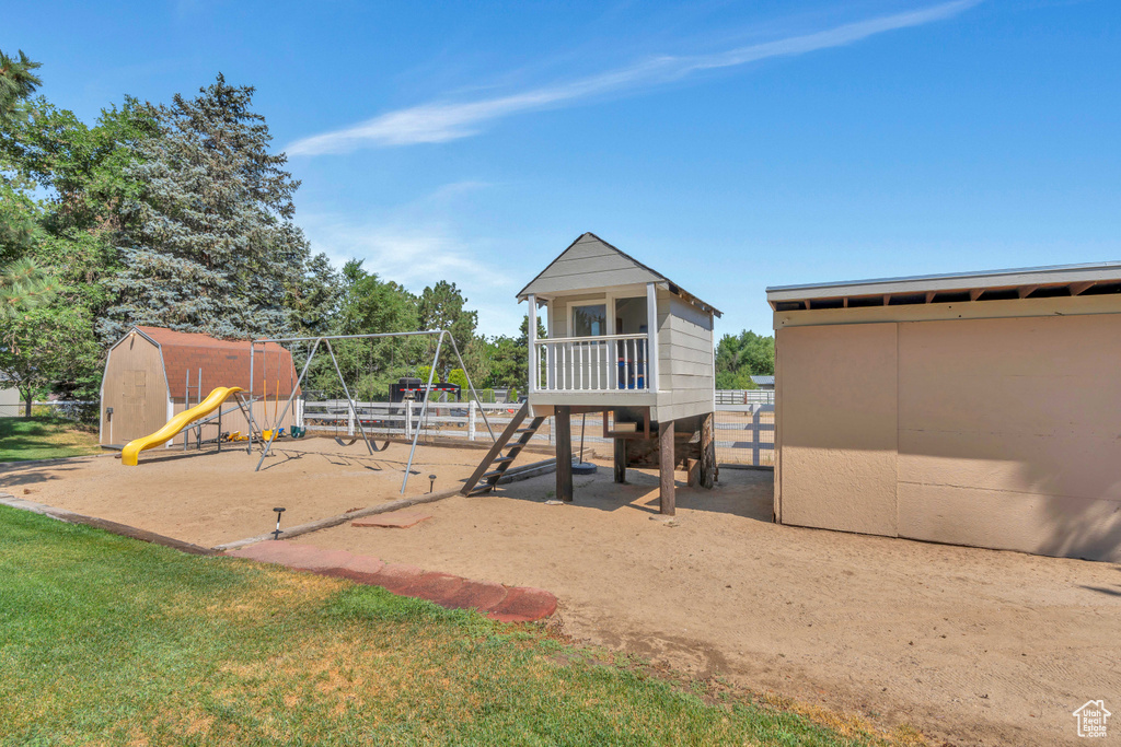 View of playground featuring a lawn