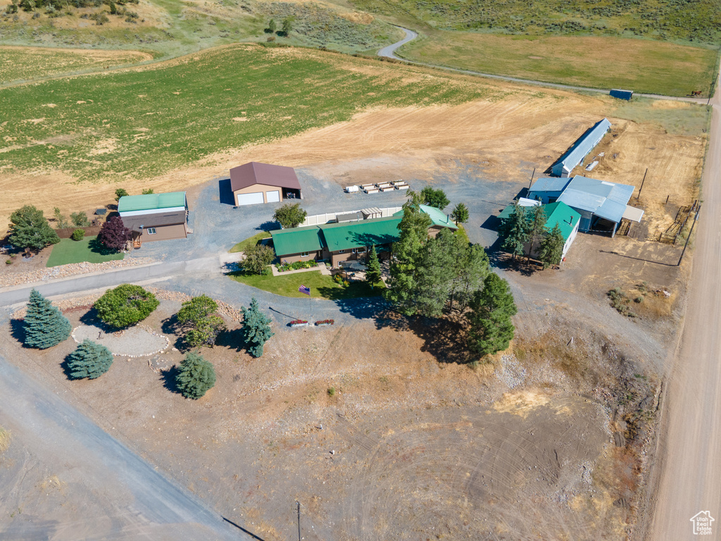 Birds eye view of property with a rural view