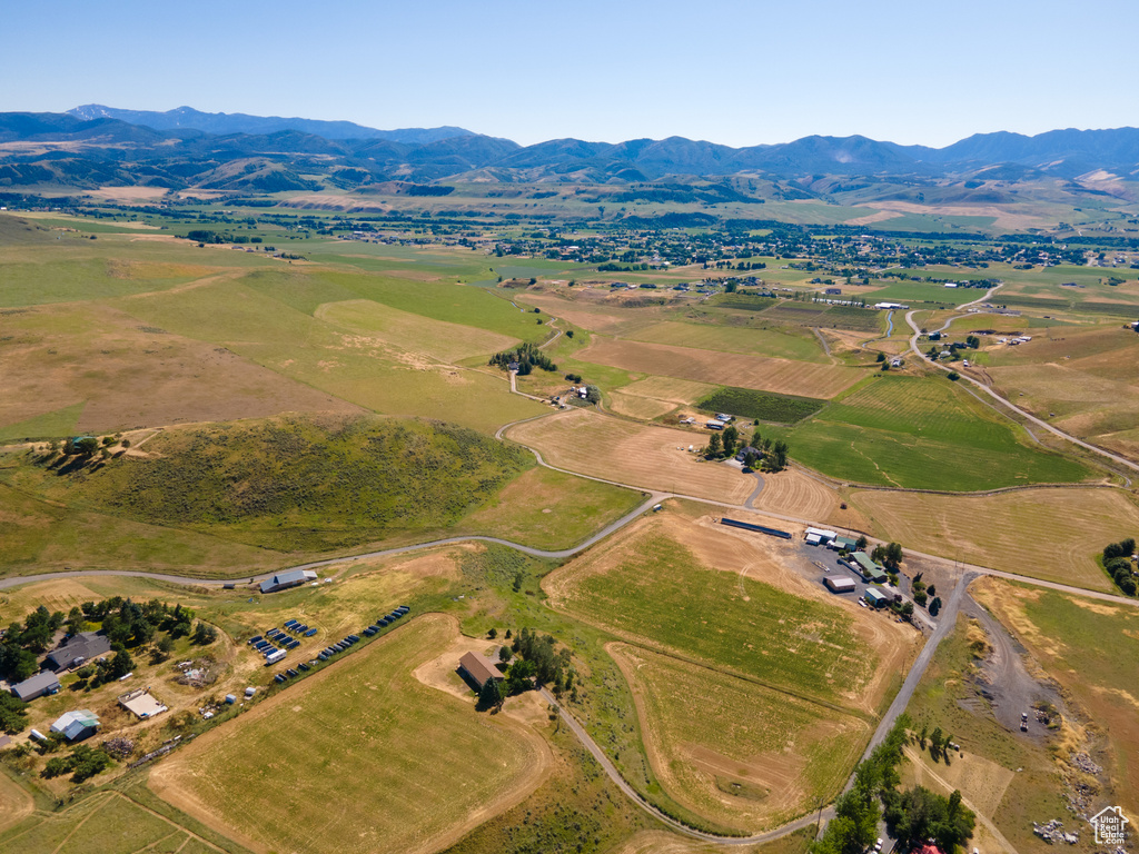 Birds eye view of property with a mountain view and a rural view