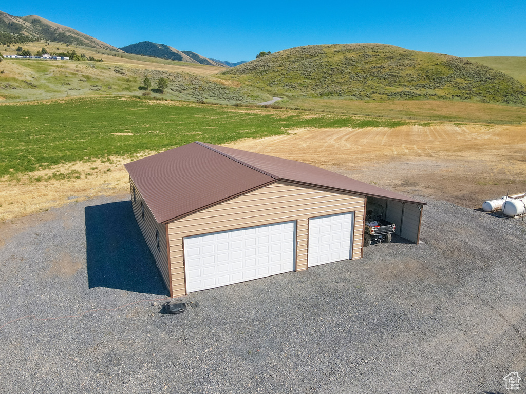 Garage with a mountain view and a rural view