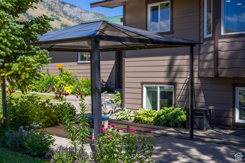 Exterior space with a mountain view and a gazebo