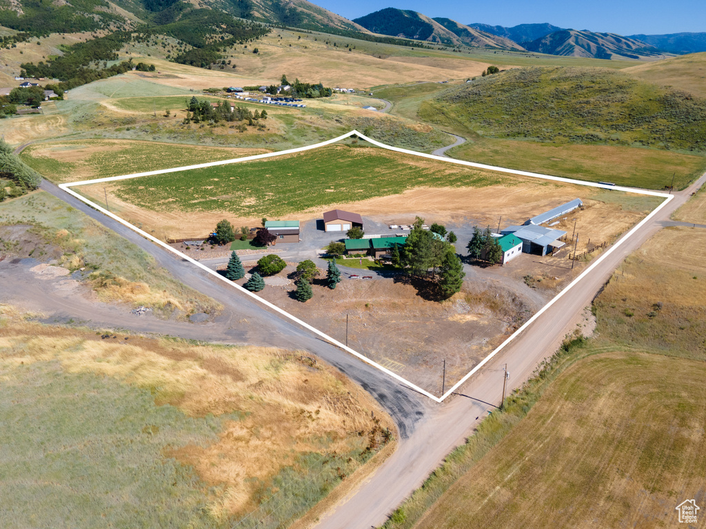 Birds eye view of property featuring a mountain view and a rural view