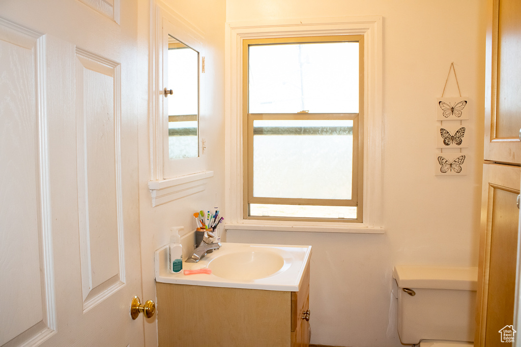 Bathroom featuring toilet and vanity