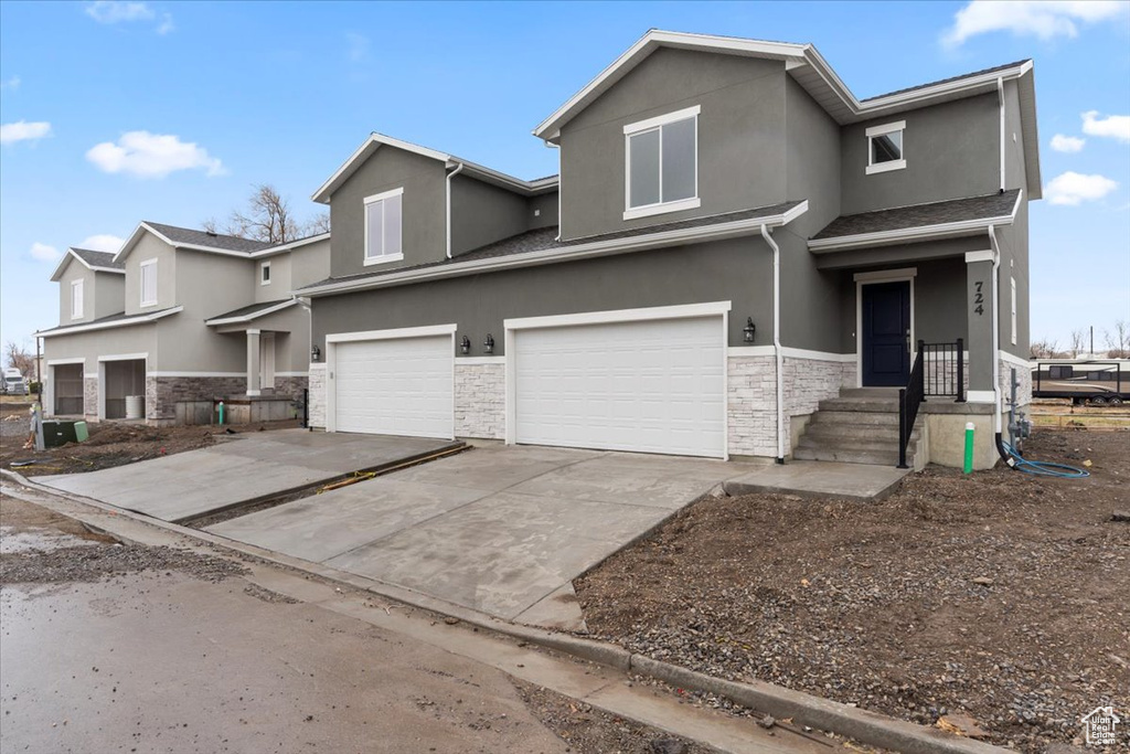 View of front of property featuring a garage