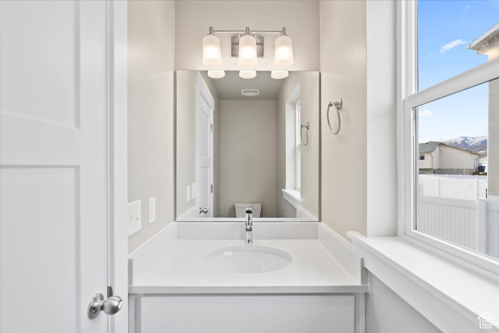 Bathroom featuring vanity and toilet