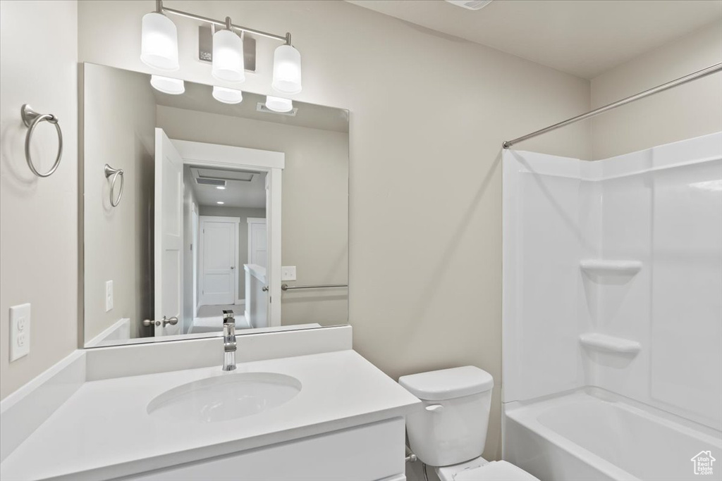 Full bathroom featuring vanity, toilet, and bathing tub / shower combination