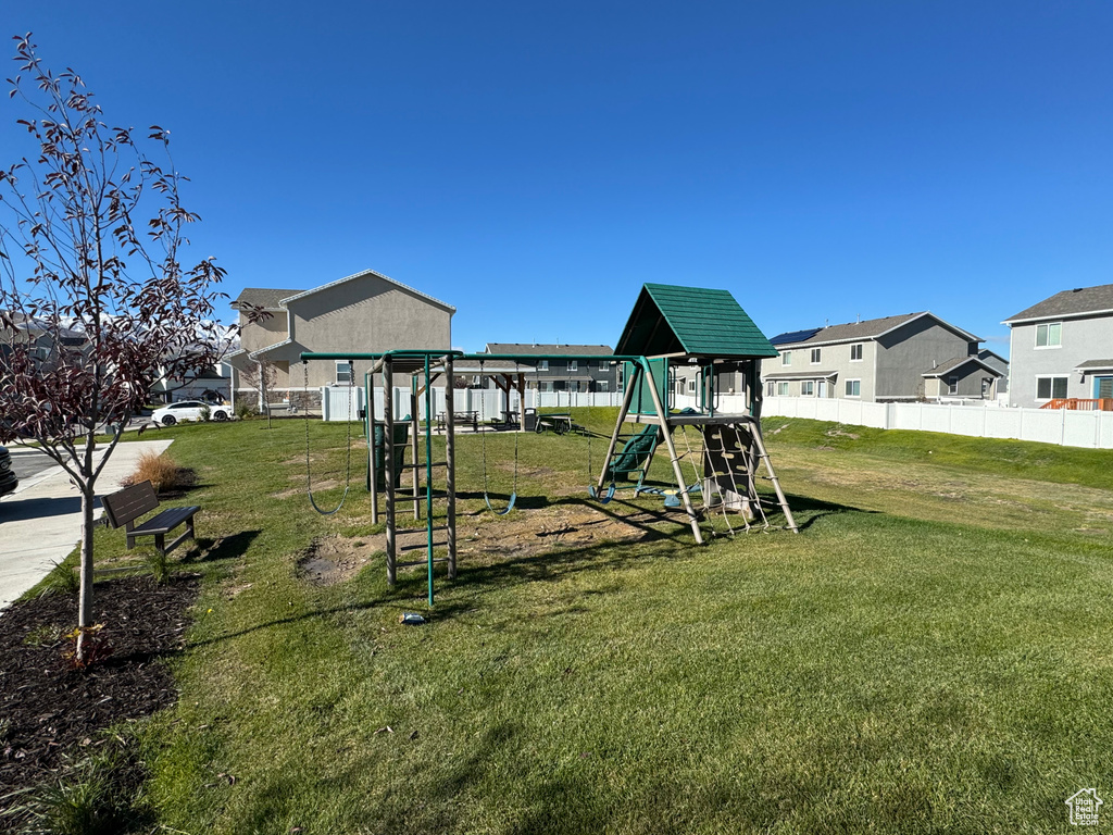 View of playground with a lawn