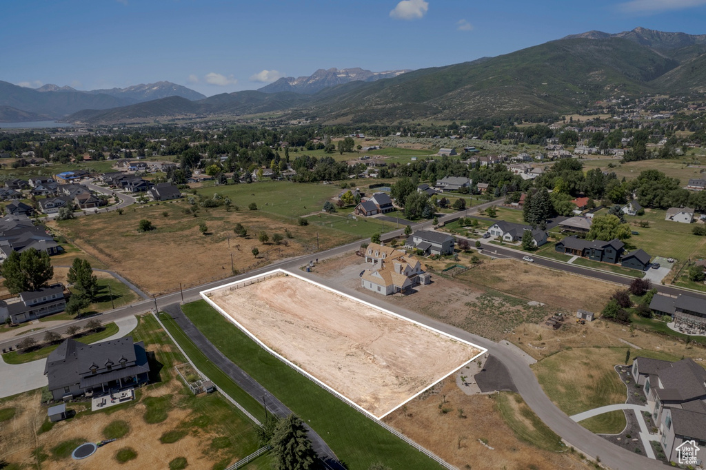 Birds eye view of property with a mountain view