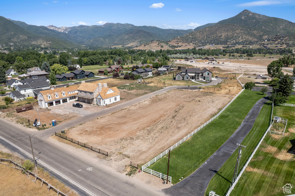 Birds eye view of property with a mountain view