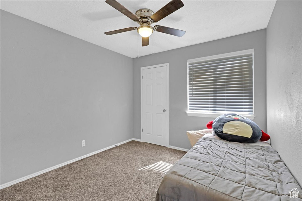 Bedroom with carpet floors and ceiling fan