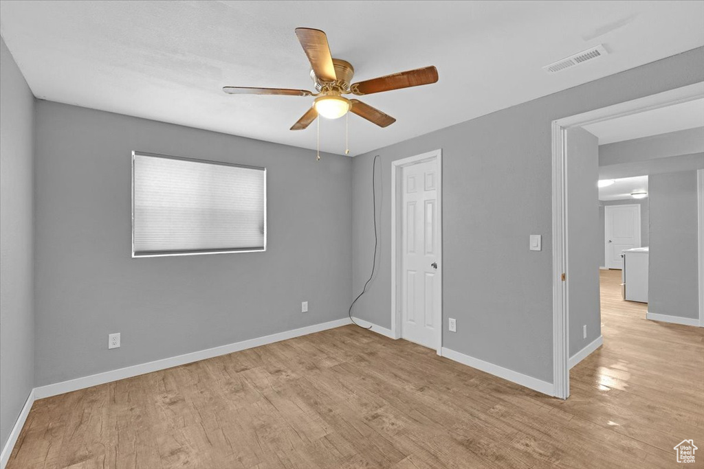 Unfurnished bedroom with light hardwood / wood-style flooring and ceiling fan