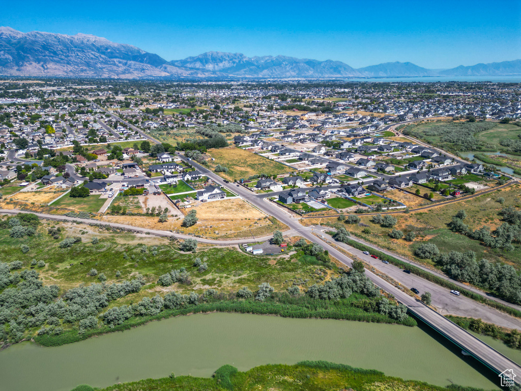 Aerial view featuring a water and mountain view