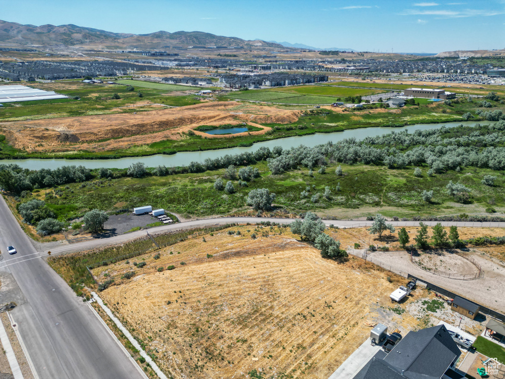 Drone / aerial view with a water and mountain view