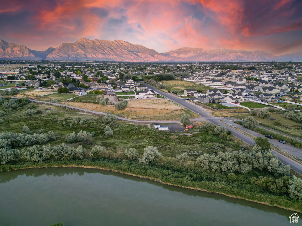 Aerial view at dusk with a water and mountain view