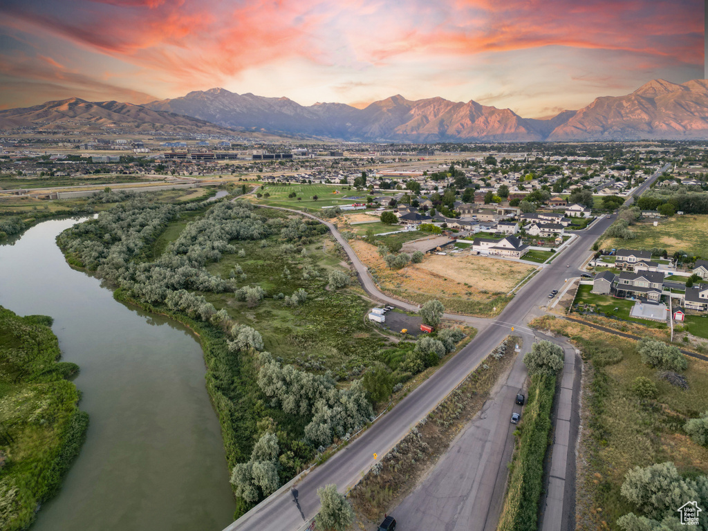 Aerial view at dusk with a water and mountain view