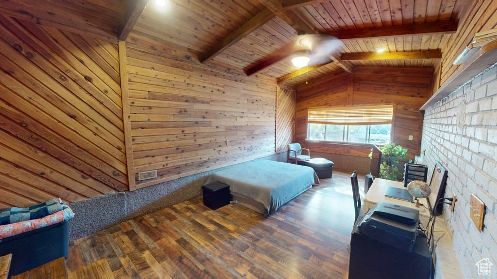 Bedroom featuring dark wood-type flooring, wood walls, wood ceiling, and lofted ceiling with beams