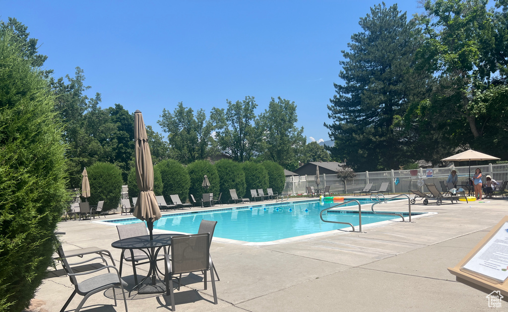 View of swimming pool with a patio area