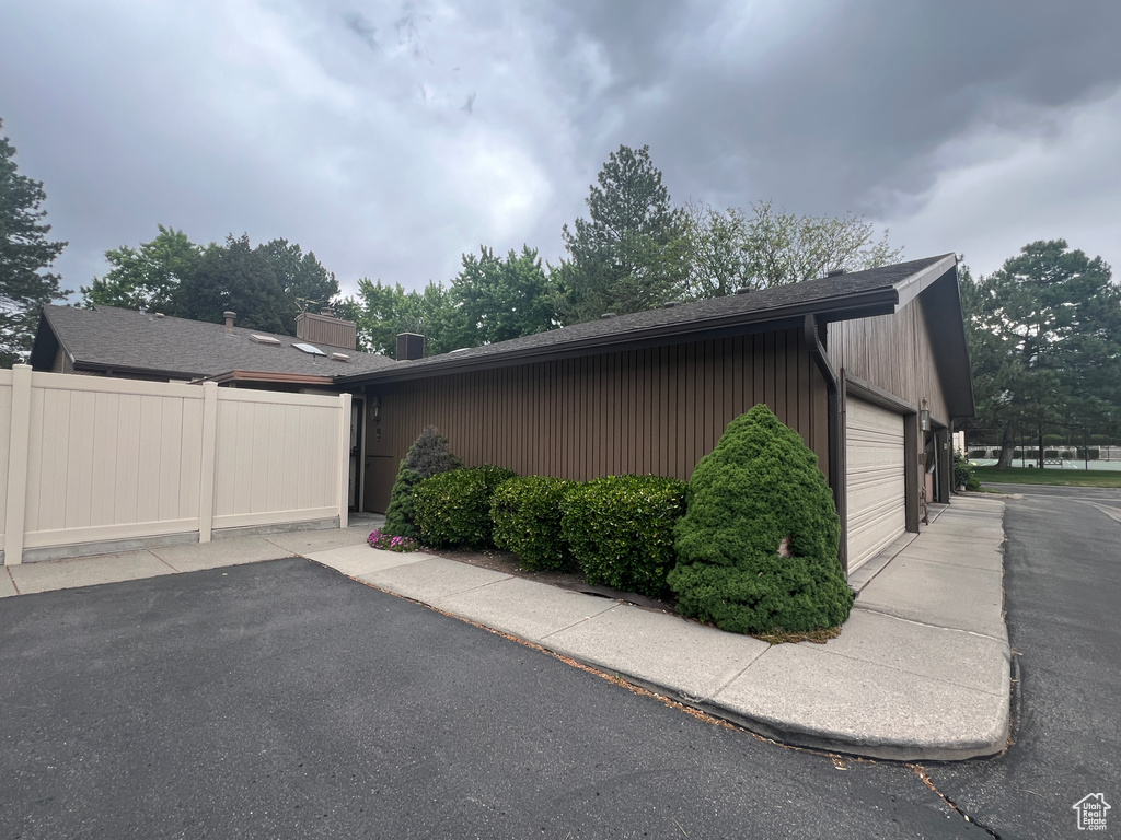 View of side of property featuring a garage