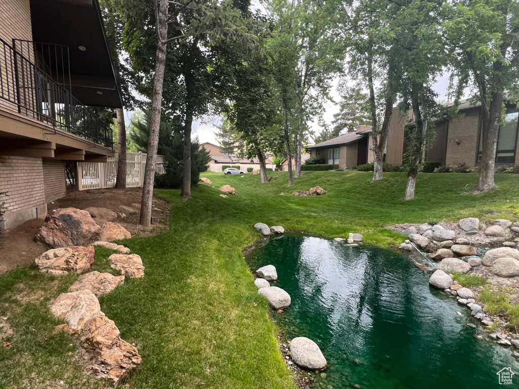 View of yard featuring a balcony