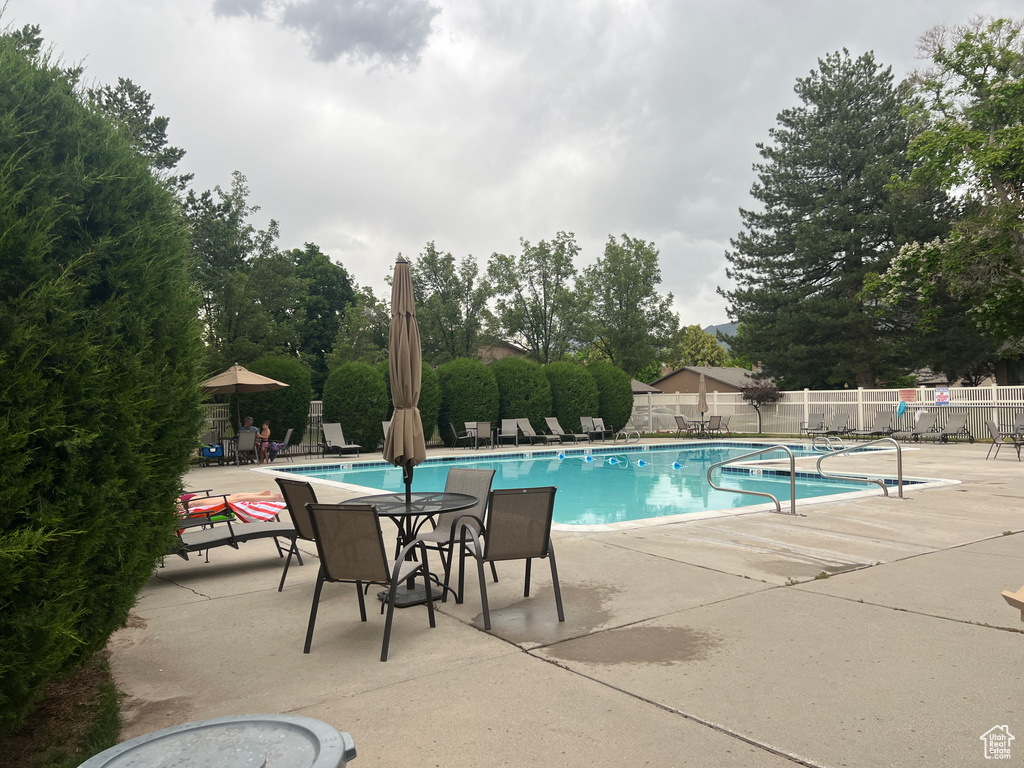 View of swimming pool with a patio