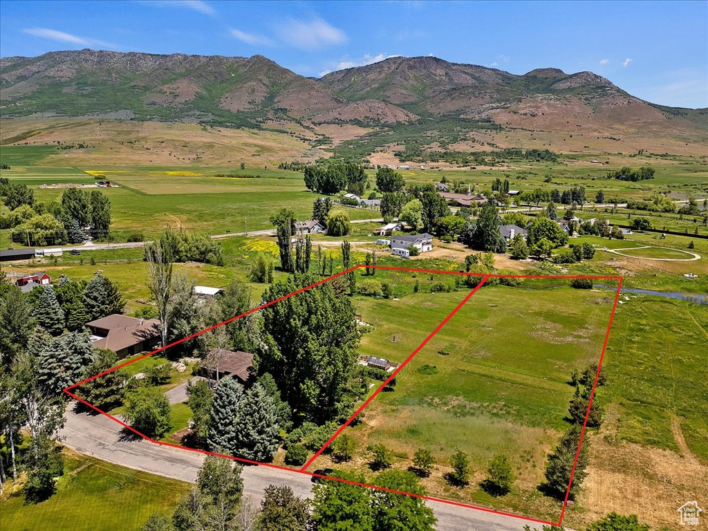 Birds eye view of property with a mountain view and a rural view